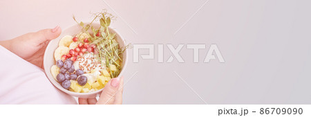 Pregnant woman eating healthy food. Organic calcium salad. Fruits and microgreen Pregnant woman eating healthy food. Organic calcium salad. Fruits and microgreen 86709090