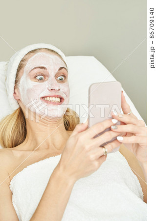Portrait of moisturizing clay mask for medical design. Woman skin procedure. 86709140