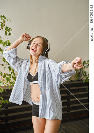 Young woman sing at home. House lyrics dance. Funny song. Independent portrait Young woman sing at home. House lyrics dance. Funny song. Independent portrait 86709142