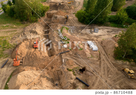 Excavator dig ground at a construction site.  86710488