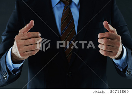 Let's embrace to seal the deal. Shot of an unrecognizable businessman gesturing with his hands. Let's embrace to seal the deal. Shot of an unrecognizable businessman gesturing with his hands. 86711869