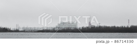 Industrial zone of the combined heat and power plant, near the water of the lake with the smog of environmental pollution with the thermal power plant of an industrial enterprise Industrial zone of the combined heat and power plant, near the water of the lake with the smog of environmental pollution with the thermal power plant of an industrial enterprise 86714330