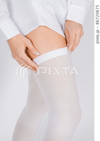Anti-embolic Compression Hosiery for surgery isolated on white. Medical white stockings, tights for varicose veins and venouse therapy. Thrombo embolic deterrent hose or anti-embolism stockings. Anti-embolic Compression Hosiery for surgery isolated on white. Medical white stockings, tights for varicose veins and venouse therapy. Thrombo embolic deterrent hose or anti-embolism stockings. 86720675