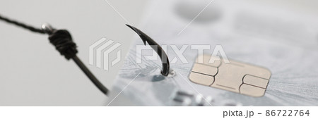 Bank plastic card hanging on fishing hook closeup Bank plastic card hanging on fishing hook closeup 86722764