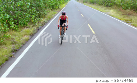 Asian young woman ride bicycle 86724469