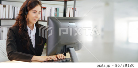 Business people wearing headset working in office broaden view Business people wearing headset working in office broaden view 86729130