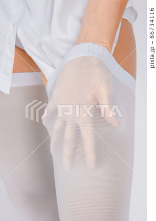Anti-embolic Compression Hosiery for surgery isolated on white. Medical white stockings, tights for varicose veins and venouse therapy. Thrombo embolic deterrent hose or anti-embolism stockings. Anti-embolic Compression Hosiery for surgery isolated on white. Medical white stockings, tights for varicose veins and venouse therapy. Thrombo embolic deterrent hose or anti-embolism stockings. 86734116