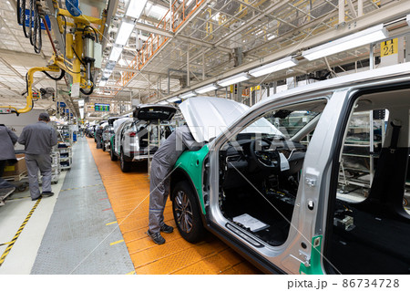 Car bodies are on assembly line. Factory for production of cars. Modern automotive industry Car bodies are on assembly line. Factory for production of cars. Modern automotive industry 86734728