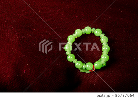 Green porch on red velvet background isolated on black background 86737064