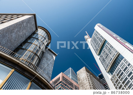 Low angle view over contemporary shaped office buildings 86738000