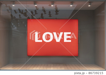 love is the word on the red billboard. the day is a symbol of love or holiday sales concept love is the word on the red billboard. the day is a symbol of love or holiday sales concept 86739215