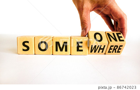 Someone somewhere symbol. Businessman turns wooden cubes and changes the concept word Someone to Somewhere. Beautiful white table, white background, copy space. Business, someone somewhere concept. Someone somewhere symbol. Businessman turns wooden cubes and changes the concept word Someone to Somewhere. Beautiful white table, white background, copy space. Business, someone somewhere concept. 86742023