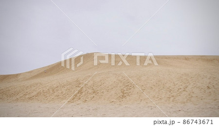 Tiny humans in a part of the Tottori sand dune, Japan. 86743671