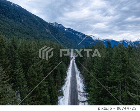 Aerial View from above of Road in a valley during winter 86744725