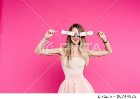 Pretty girlfriends with marshmallows on stick 86744928