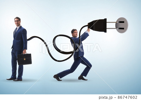 Businessman being powered by electric power 86747602