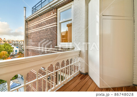 balcony with a shelf,wooden floor and street view balcony with a shelf,wooden floor and street view 86748028