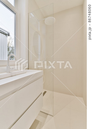 modern white bathroom with white sink and shower cabin 86748060