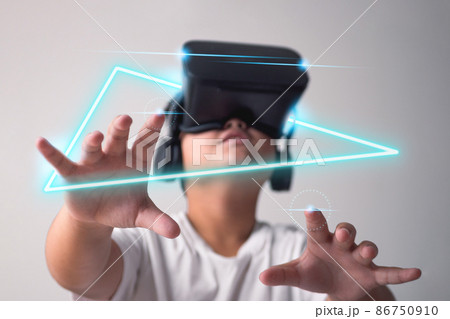 In home, the child uses virtual reality box, VR. Metaverse concept. New trend technology for future. Easy to find experiences. This shot is focused on hands. 86750910