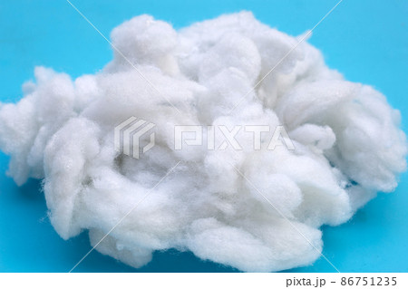 Polyester stable fiber on blue background. 86751235
