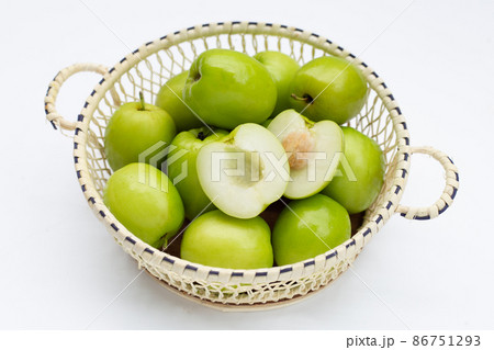 Milk jujube in basket on white Milk jujube in basket on white 86751293
