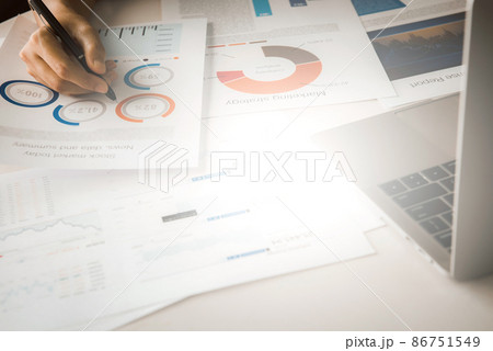 Businessman analyzing investment charts with laptop. Accounting and Business concept 86751549
