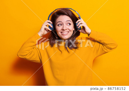 Caucasian woman feeling excited and listening to music 86758152