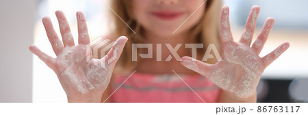 Little girl shows hands in flour. Cooking class for children Little girl shows hands in flour. Cooking class for children 86763117