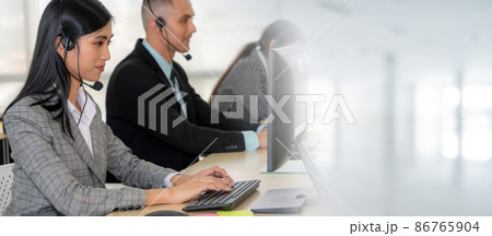 Business people wearing headset working in office broaden view 86765904