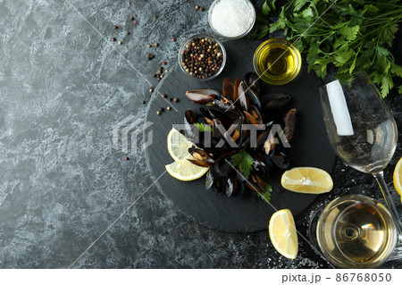 Concept of delicious food with mussels on black smokey table 86768050
