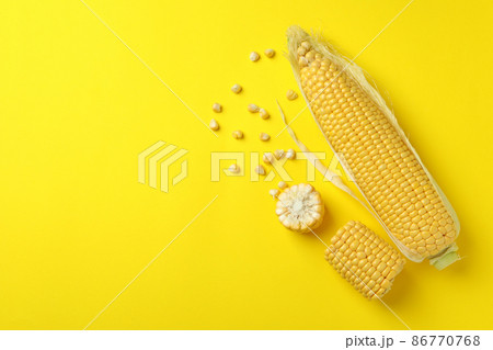 Fresh raw corn on yellow background, top view 86770768