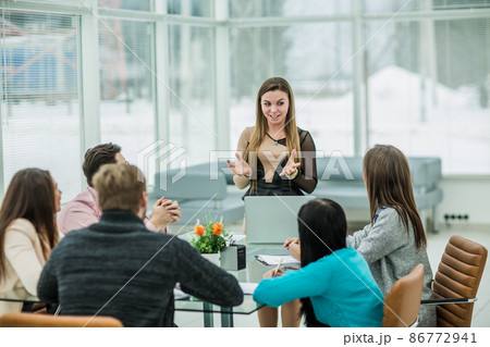 Manager conducts the presentation of the new advertising project of the company in the spacious office 86772941