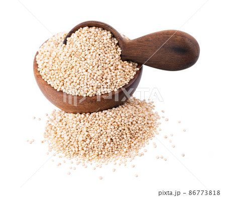 White quinoa seeds in wooden bowl and spoon, isolated on white background. Pile of raw kinwa. 86773818
