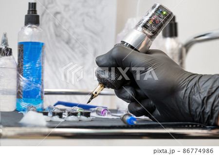 Close up of tattoo artist tools and workplace 86774986
