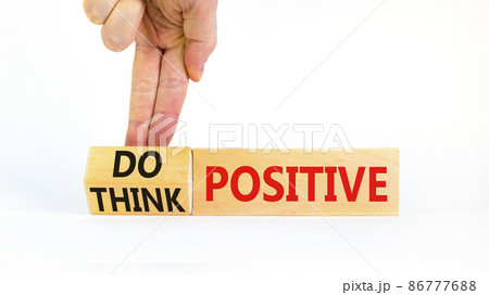 Think and do positive symbol. Businessman turns wooden cubes and changes words think positive to do positive. Beautiful white background. Business, think and do positive concept. Copy space. 86777688