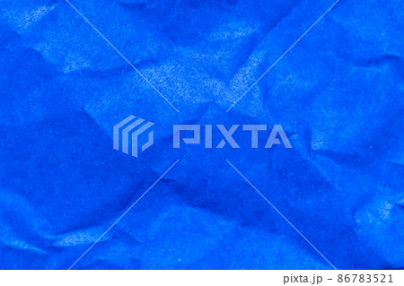 Grunge wrinkled blue color paper textured background Grunge wrinkled blue color paper textured background 86783521