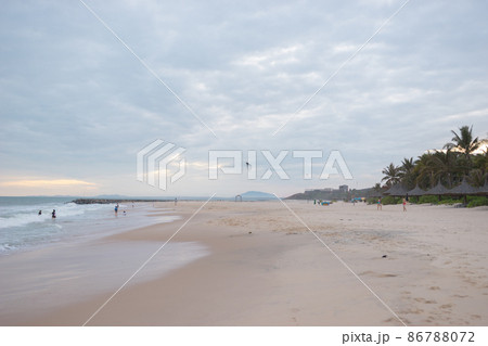 Scenic view of the sea. Beach activities, holidays, weekends on the seacoast, ocean view. Balloon in the form of a black octopus flies on the beach.  86788072