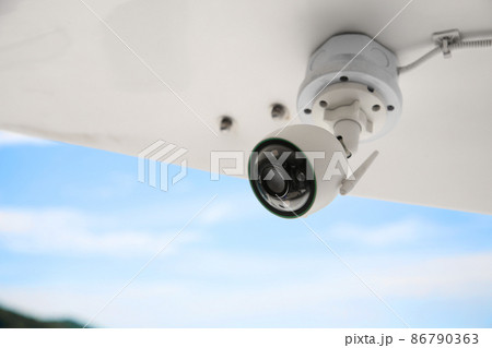 Close up of CCTV camera over defocused background. 86790363
