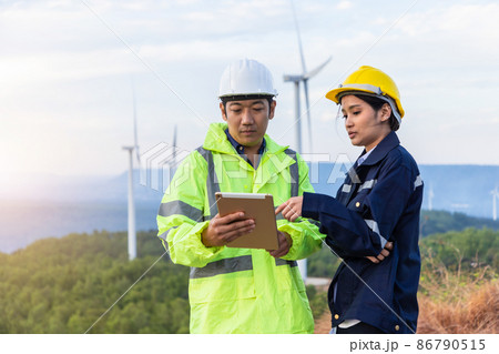 Engineers analysis windmill engineers inspection and progress check wind turbine. Engineers analysis windmill engineers inspection and progress check wind turbine. 86790515