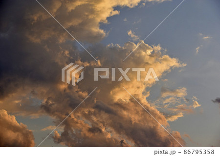 Evening cumulus red and blue clouds over the city 86795358