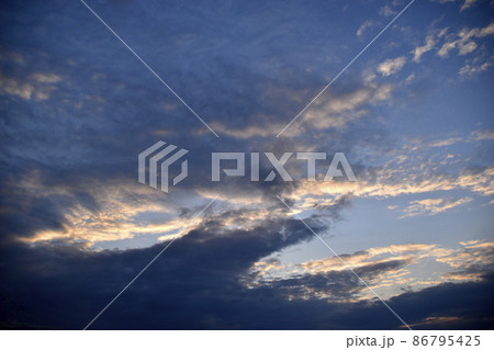 Evening cumulus red and blue clouds over the city Evening cumulus red and blue clouds over the city 86795425