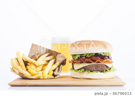 Hamburger with fries and beer, isolated on white background. 86796013