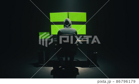 Anonymous hacker using computer in darkness Anonymous hacker using computer in darkness 86796179