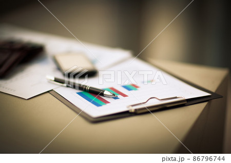 financial charts and graphs on the table 86796744