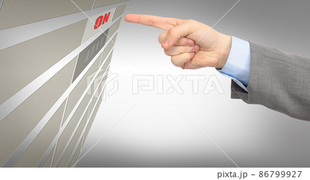 The hand of man presses a button. The hand of man presses a button. 86799927