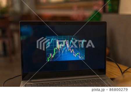 Laptop screen with stock charts. Work on a computer in a cafe. Freelancing in a coffee shop. Trading, cryptocurrency. High quality photo Laptop screen with stock charts. Work on a computer in a cafe. Freelancing in a coffee shop. Trading, cryptocurrency. High quality photo 86800279