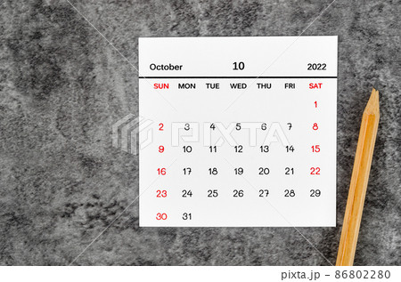 October 2022 and wooden pencil on vintage dark background. October 2022 and wooden pencil on vintage dark background. 86802280