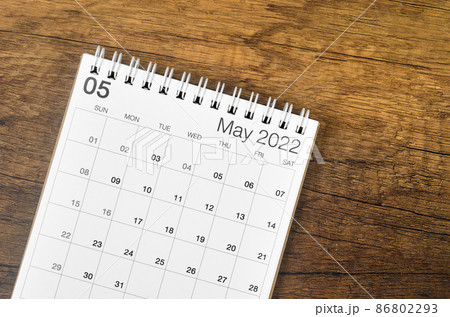 May 2022 desk calendar on wooden background. May 2022 desk calendar on wooden background. 86802293
