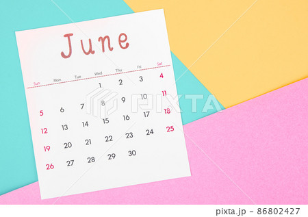 June 2022 calendar on multicolored background. 86802427