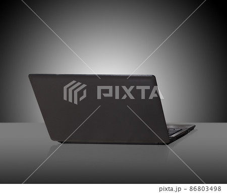modern and stylish laptop on a dark background modern and stylish laptop on a dark background 86803498